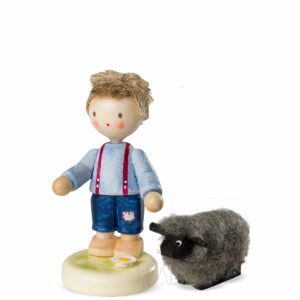 Junge mit schwarzem Schaf